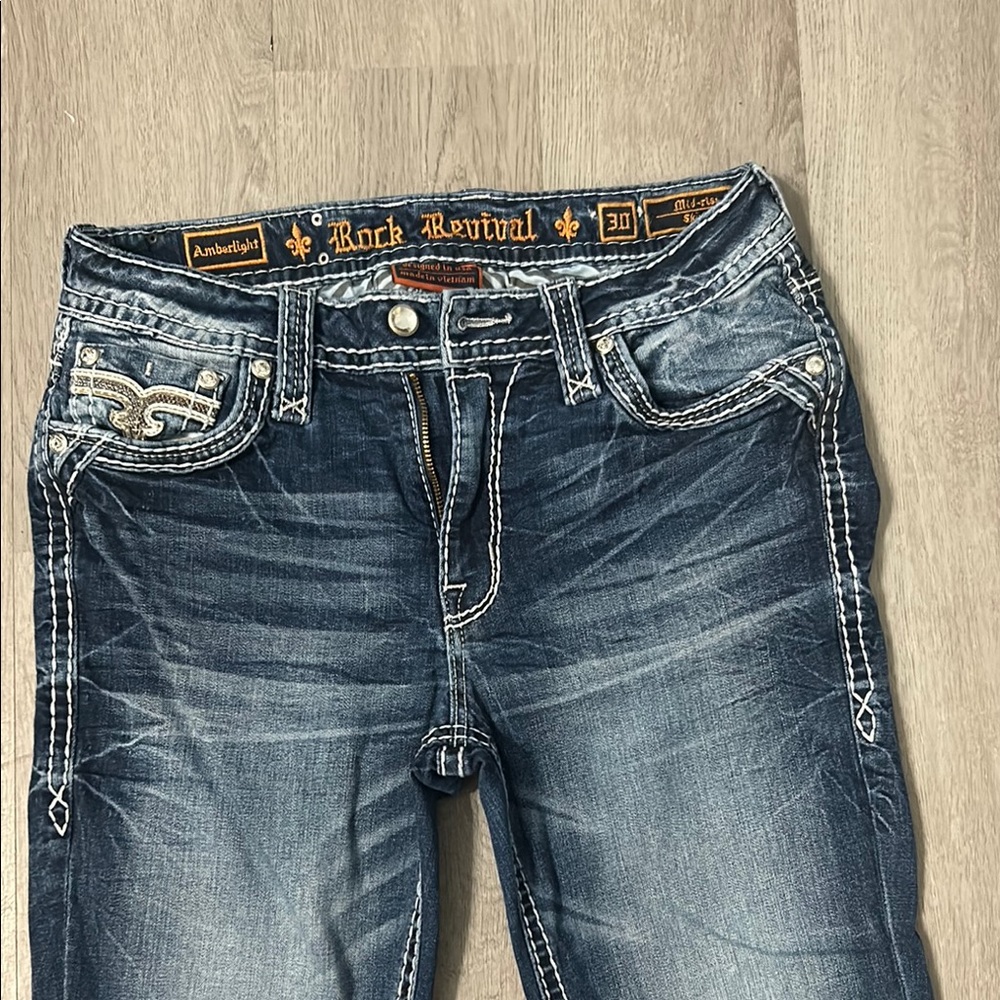Rock Revival Blue Boot Cut Jeans with Distressed Details